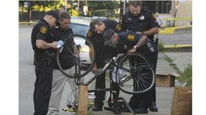 Police Inspecting a Crashed Bike